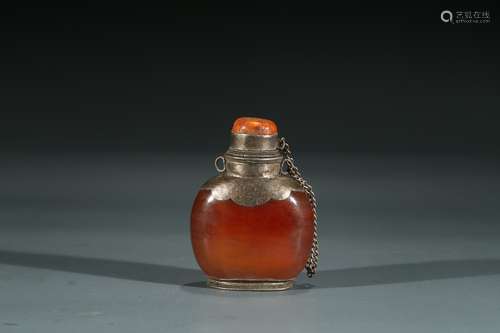 A SILVER MOUNTED AMBER SNUFF BOTTLE