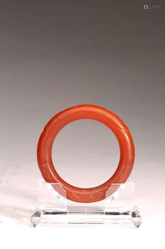 A CHINESE AGATE CARVED BANGLE