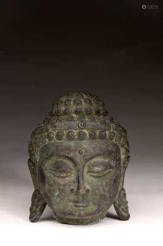 A CHINESE PATINATED BRONZE BUDDHA HEAD