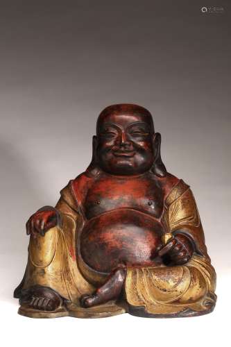 A CHINESE GILT LACQUERED FIGURE OF SEATED BUDAI