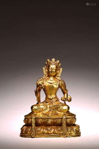 A GILT BRONZE FIGURE OF SEATED VAJRASATTVA