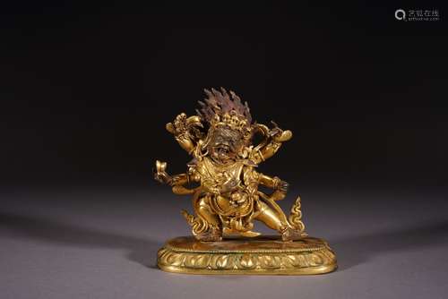 A GILT BRONZE FIGURE OF STANDING MAHAKALA