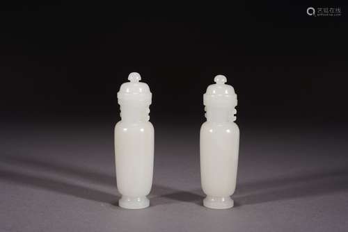 A PAIR OF WHITE JADE VASES AND COVERS