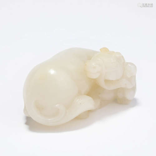 A carved white jade mythical beast ornament