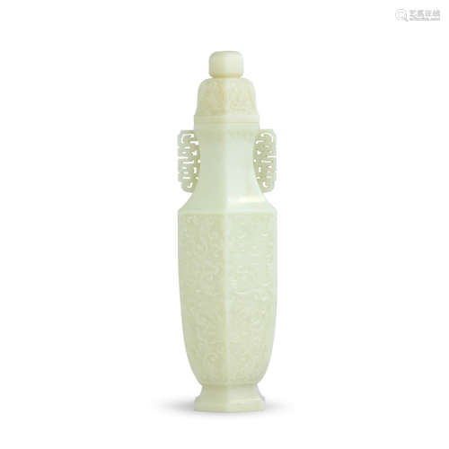 A carved white jade interlocking lotus and flanked vase and ...