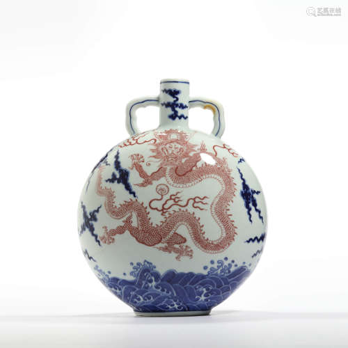 An underglaze-blue and copper-red dragon and cloud moonflask