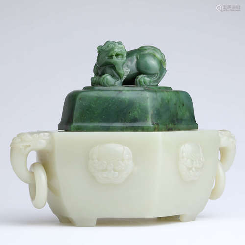 A white jade beast incense burner and spinach-green jade cov...