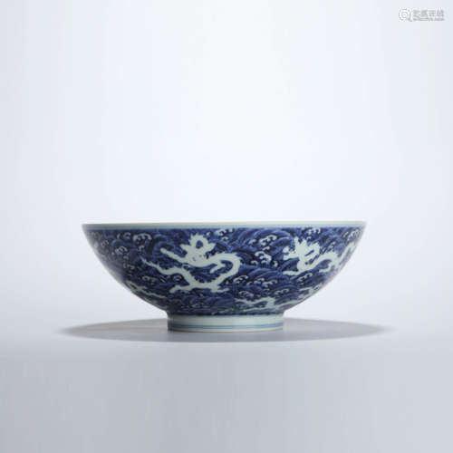 A blue and white dragon and wave bowl