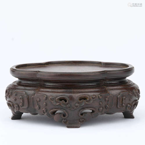 A carved sandalwood lobed stand