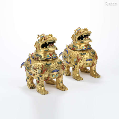 A pair of gems inlaid and gilt bronze beast incense burners