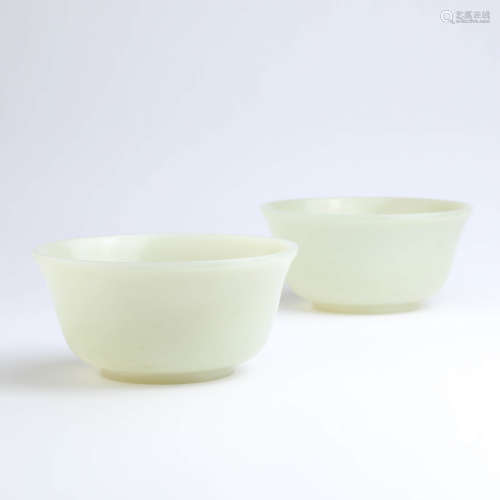 A pair of white jade bowls