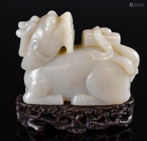 A Carved White Jade Carved Kirin w/Stand 19thC