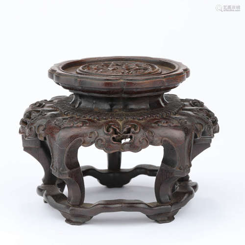 A carved sandalwood lobed stand