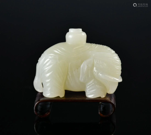 A White Jade Elephant Carving With Stand