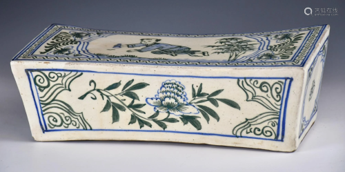 A Blue And White Porcelain Pillow With Figure