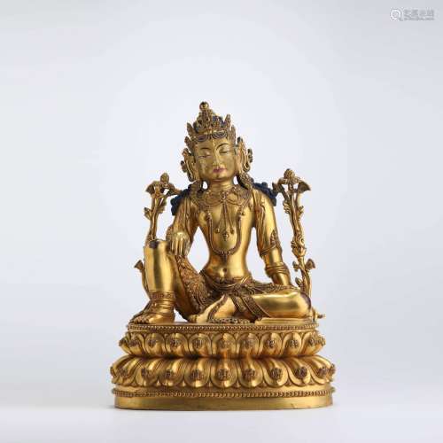 A gilt bronze seated statue of avalokitesvara