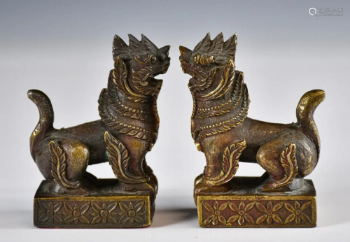 A Pair of Gilt-Bronze Mythical Beast Paperweights