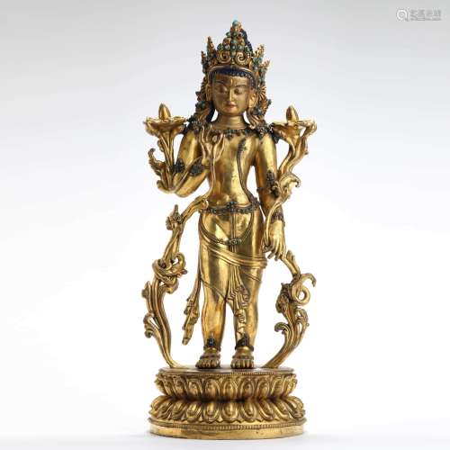 A gilt bronze standing statue of tara