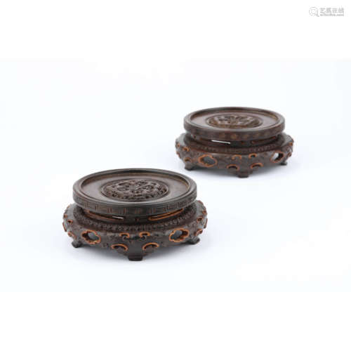 A pair of carved sandalwood lobed stands