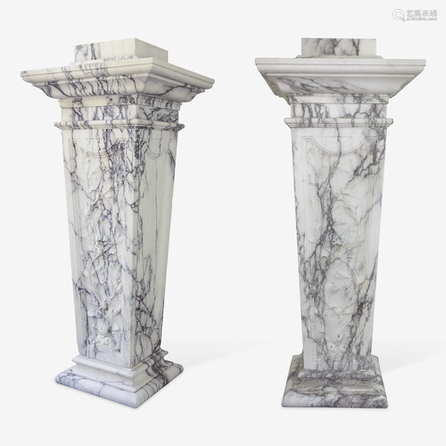 A Large Pair of Variegated White Marble Pedestals*