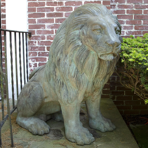 A Large Pair of Verdigris Cast Metal Seated Lions*