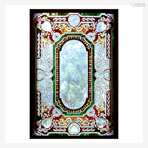 A Large Faceted, Colorless, and Stained Glass Window