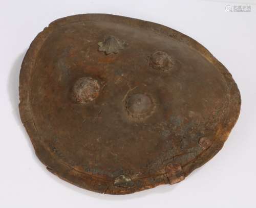 Early 19th Century Indian hide Dhal shield, with four iron b...