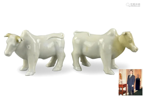 Pair of Dehua Ware White Glazed Cow, 18th C.