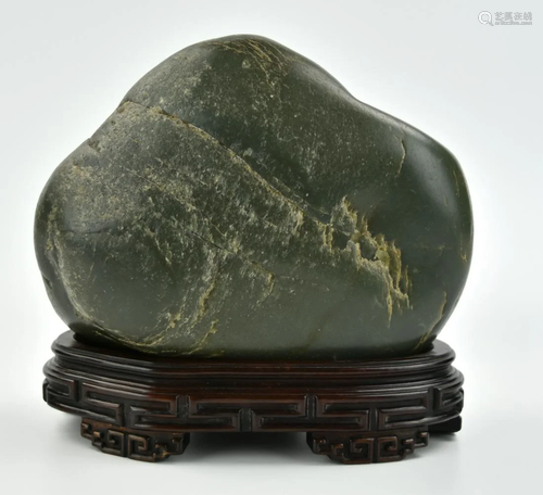 A Chinese Green Jadeite Shanzi & Wood Base