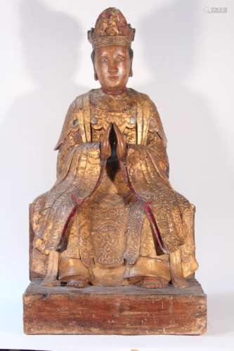 Sculpture de Bodhisattva en bois laqué or, représenté assis,...