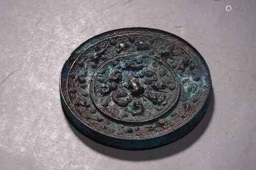 A Bronze Sea Beast And Grapevines Circular Mirror