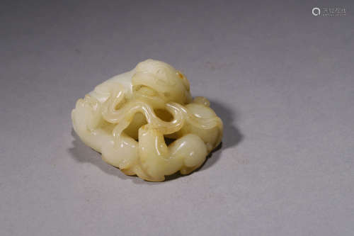 A Carved White Jade Beast Group Ornament