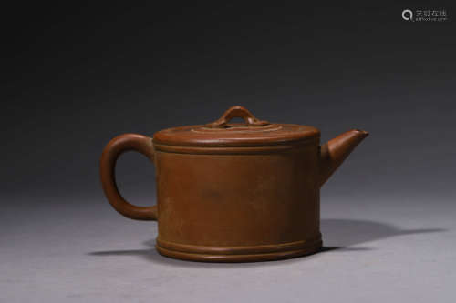 A Purple Clay Inscribed Ruyi-Finial Teapot