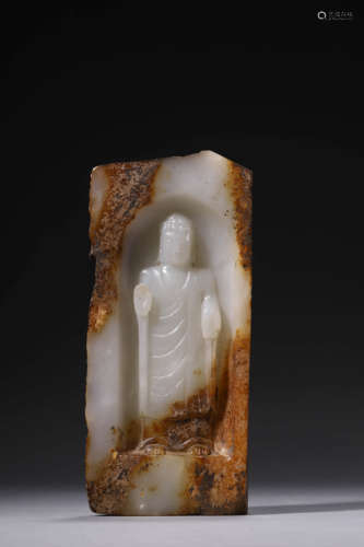 A Carved White And Russet Jade Statue Of Shakyamuni