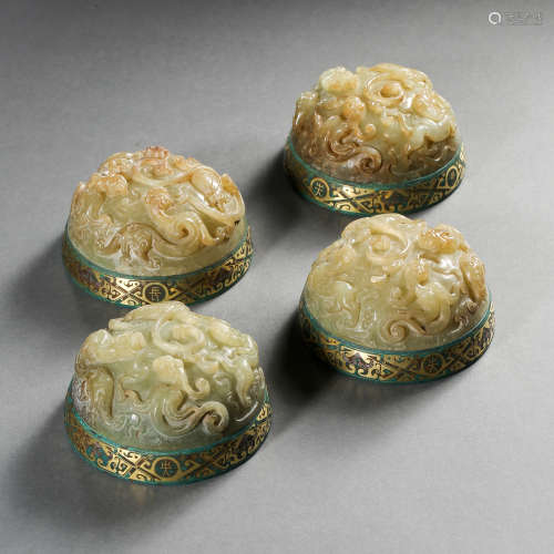 A GROUP OF HETIAN JADE PAPERWEIGHTS INLAID WITH GOLD AND SIL...