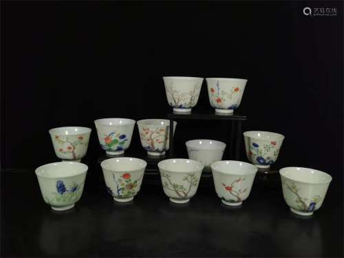 A SET OF COLORFUL TWELVE FLOWER GOD CUPS IN QING DYNASTY