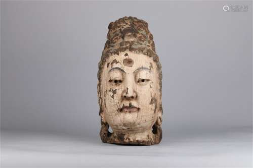 A WOODEN BUDDISM HEAD