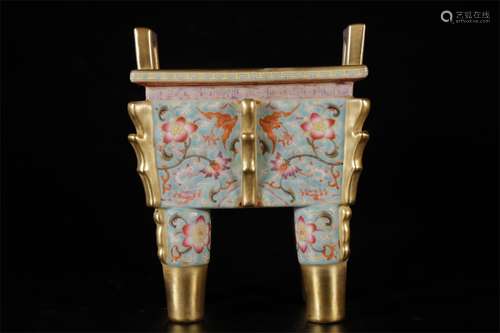 FOUR LEGGED STOVE WITH PASTEL AND GOLD PAINTED FLOWER PATTER...