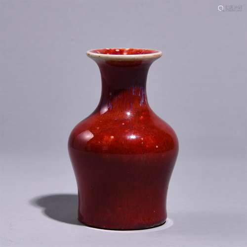 A RED GLAZED BOTTLE