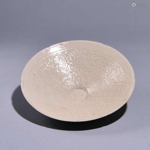 A CURVED PHOENIX PATTERNED PLATE FROM XING KILN