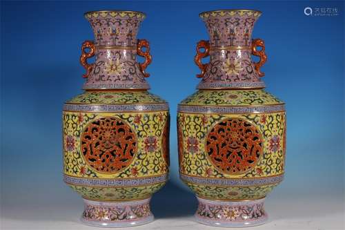 A PAIR OF HEART TURNING BOTTLES DECORATED WITH FOUR SECTIONS...