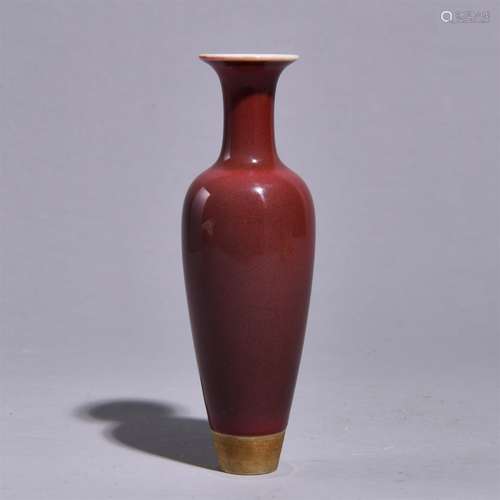 A RED GLAZED BOTTLE