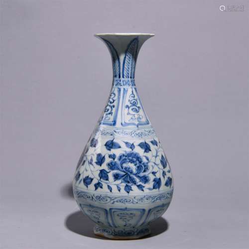 A BLUE AND WHITE FLOWERED SPRING BOTTLE