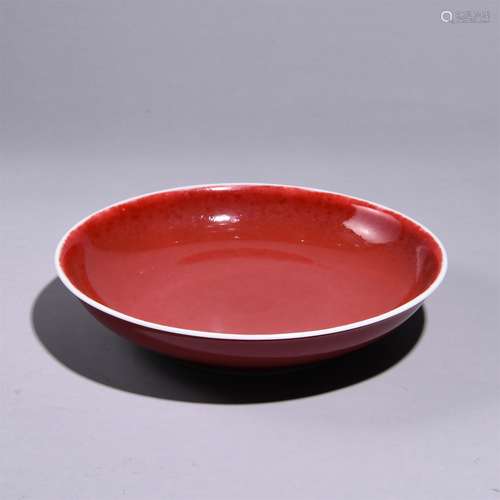 A RED GLAZED PLATE