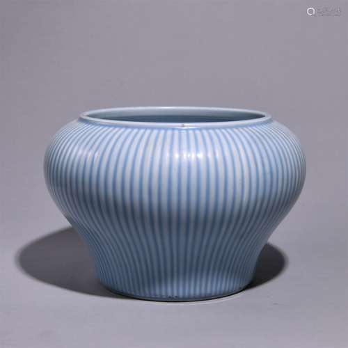 A SKY-BLUE GLAZED REEL JAR