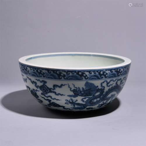 A BLUE AND WHITE DRAGON PATTERNED BOWL