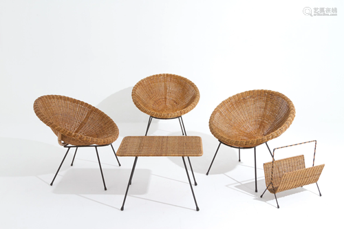 Three chairs, a magazine rack, a table in rattan