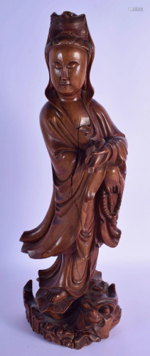 A LARGE 19TH CENTURY CHINESE CARVED HARDWOOD FIG…