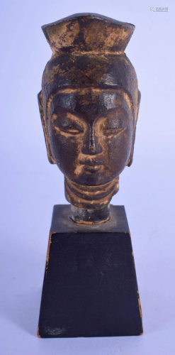 A CHINESE QING DYNASTY BRONZE BUDDHA HEAD upon an