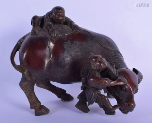 A CHINESE BRONZE FIGURE OF A BULLOCK modelled with two